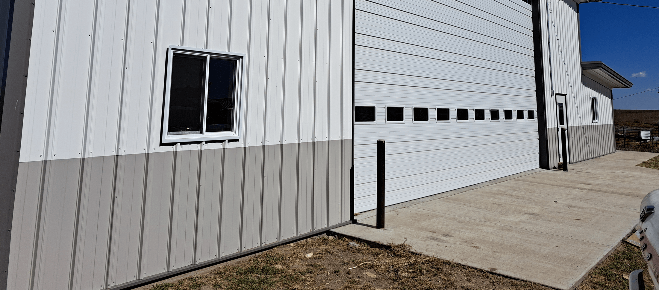 concrete pad in front of steel building