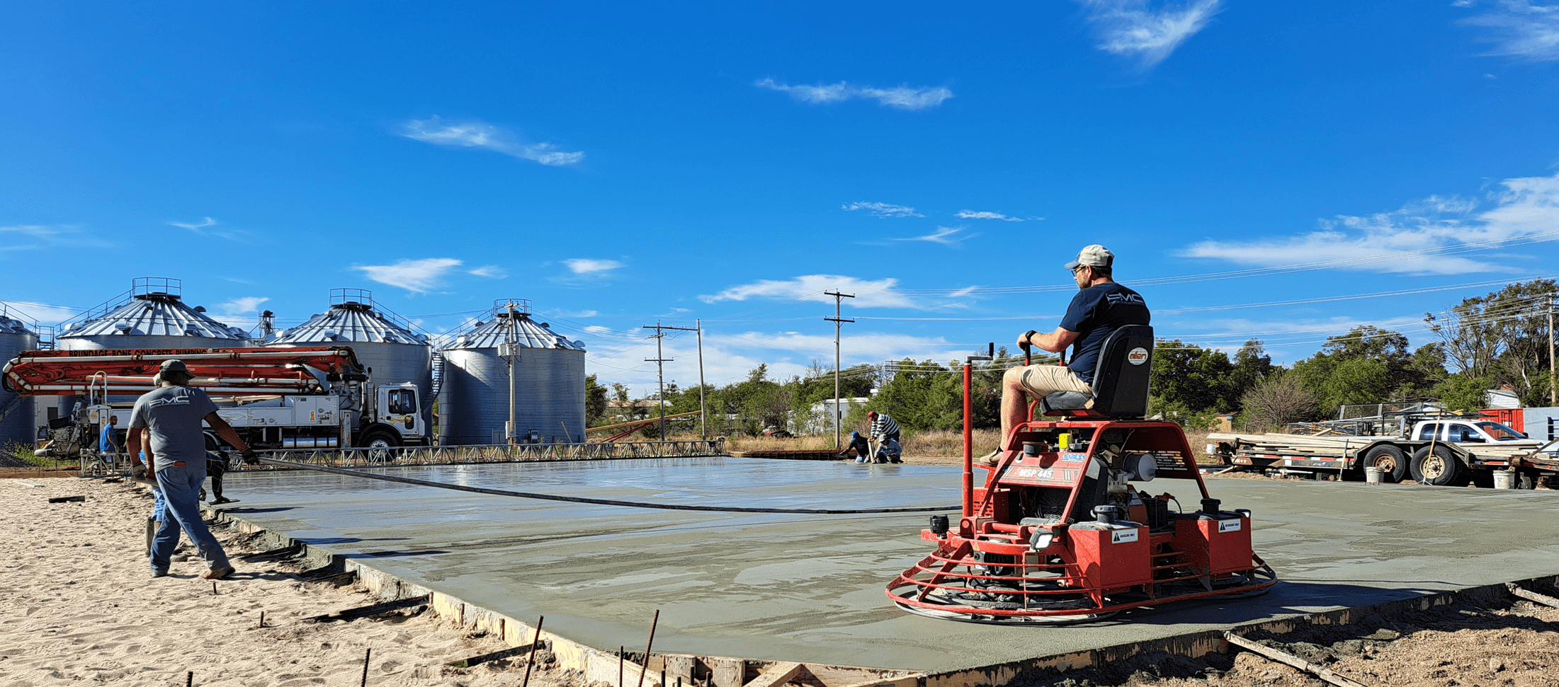 red machine working on concrete project